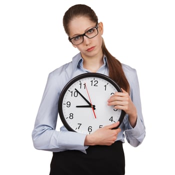 Sad girl with a big clock photo