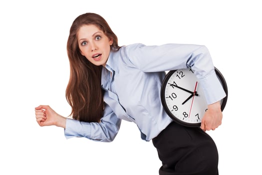 Woman in a hurry with the clock under his arm photo