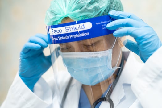 Asian doctor wearing PPE suit for protect Coronavirus photo