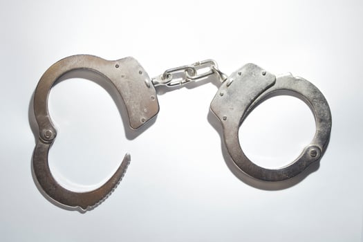cool shiny police steel handcuffs photo on white background