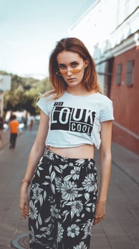 Fashion portrait stylish pretty woman in sunglasses posing in the city photo