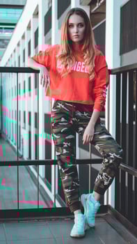 Fashion model wearing red hoodie with inscription los angeles photo