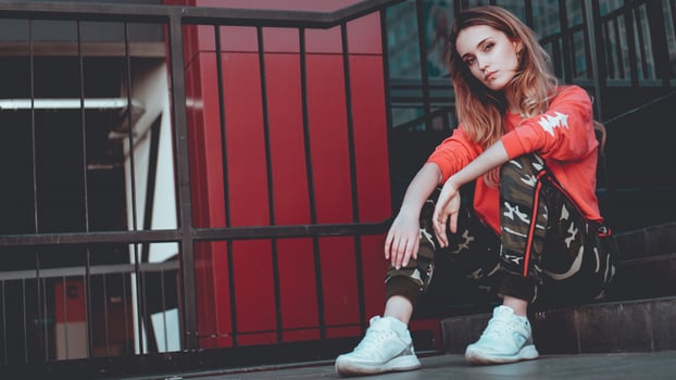 Fashion model wearing red hoodie with inscription los angeles photo