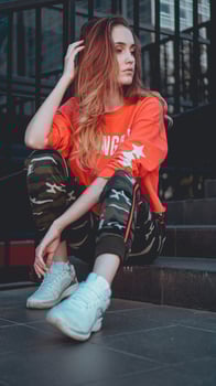 Fashion model wearing red hoodie with inscription los angeles photo