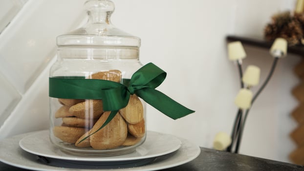 Healthy cookies with dried fruits and nuts in a glass jar photo