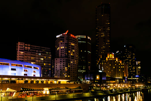 Central Melbourne city river side modern urban skyline at night in Australia photo