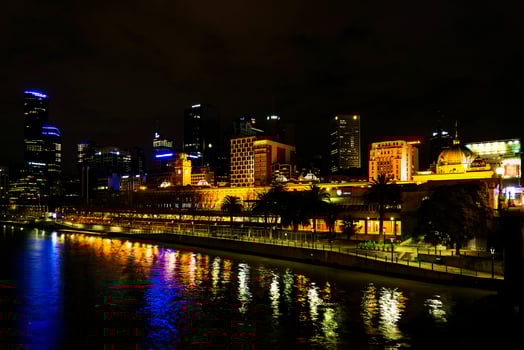 Central Melbourne city river side modern urban skyline at night in Australia photo