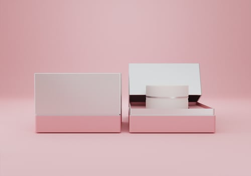 A white cream jar placed on a pink background photo