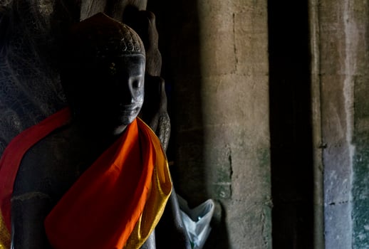 Buddha statue in Angkor Wat landmark famous Buddhist temples in Siem Reap Cambodia Asia photo