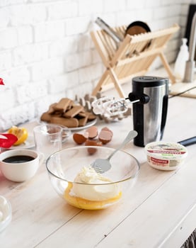 Kitchen interior with gift boxes, eggs and cooking unensils photo