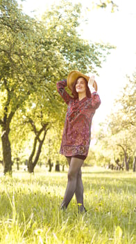 Woman Outdoor. Enjoy Nature. Healthy Smiling Girl in Park photo