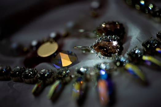 Close up details of necklace and earrings with swarovski crystal stone photo