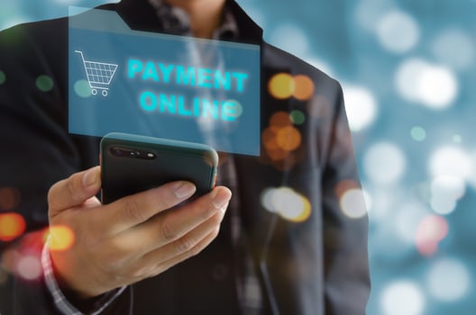 Man hand holding use mobile phones to payment online and shop online. photo