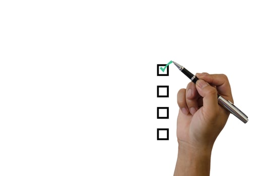 Hand holding a green checkmark on a white background photo