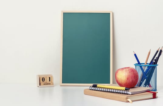 School books on the desk at home photo