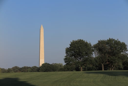 Washington Monument and american flag at Washington DC photo