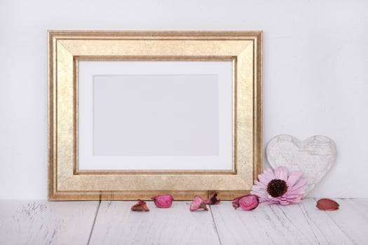 Gold frame with heart and flowers photo