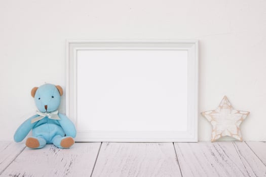 White frame with bear and star photo
