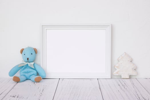 White frame with bear and tree photo