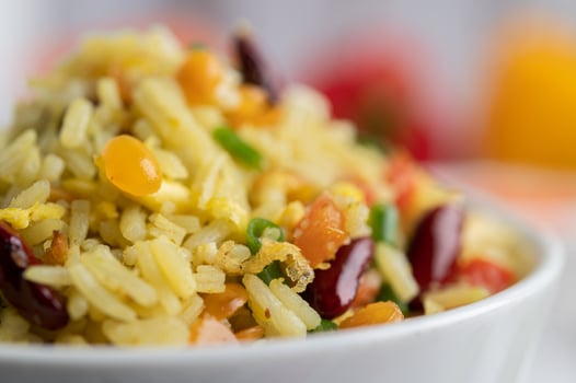 Mixed fried rice in a cup on a white wooden floor photo