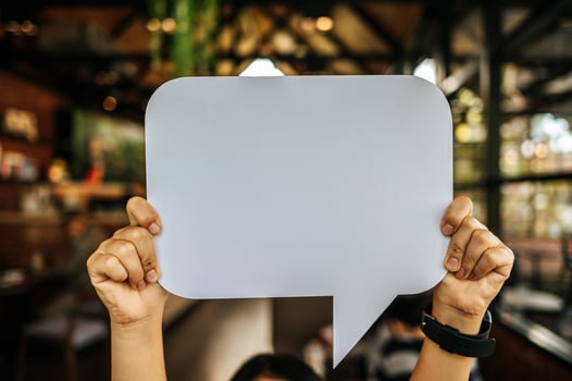 woman holding speech bubble rectangle with conners rounded photo