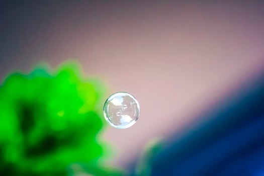 Water bubbles floating and falling on green leaves photo