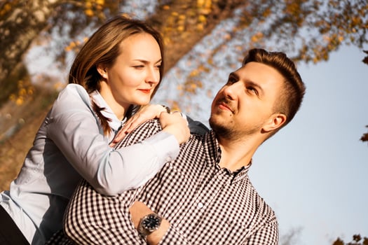 Romantic couple in autumn park - love, relationship and dating concept photo