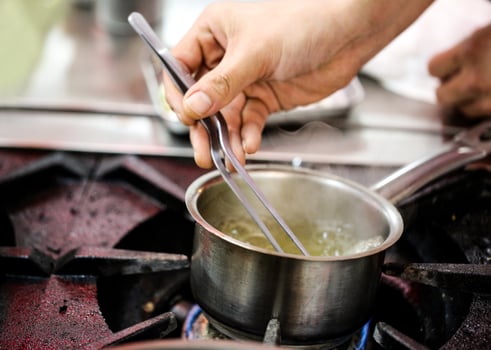 chef cooking, Chef decorating dish photo