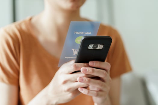 Woman using smart phone for online shopping photo