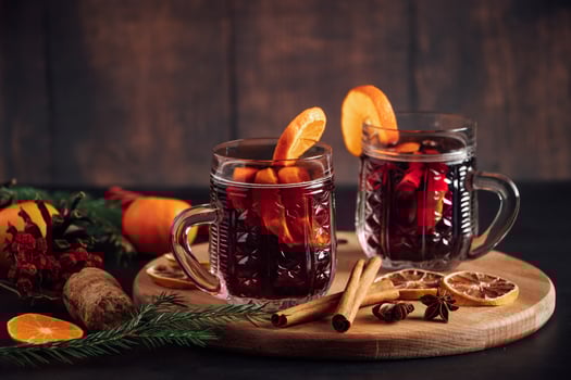 Hot mulled wine in glass cup. Warm winter drink photo