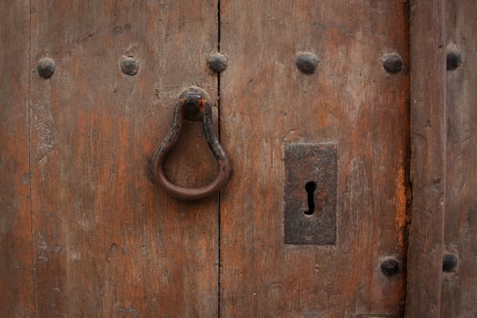 Fragment of old wooden door with handle photo