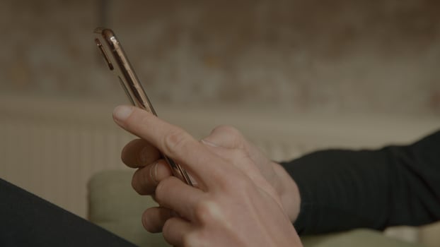Hands of woman typing on smartphone photo