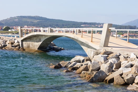 Stone bridge to connect an islet in the Arosa estuary photo