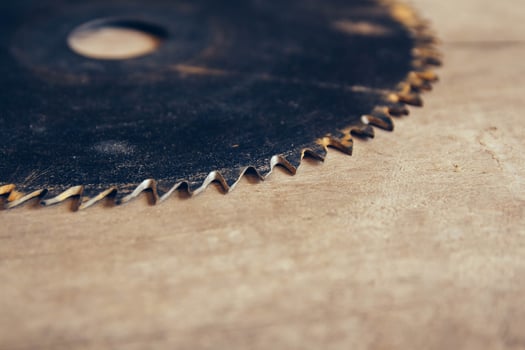 Round blade circular saw on the background of the wooden table photo