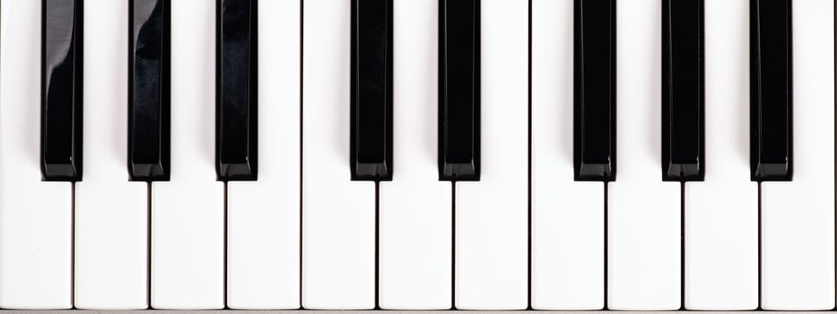 black and white piano keys, music synthesizer keys top view photo
