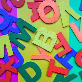 Multi colored wooden letters background photo