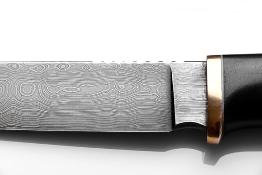 Handmade beautiful hunting knife with a sharp gray blade photo