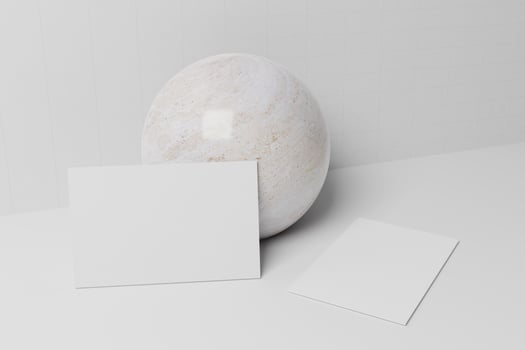 White business card paper mockup lean on marble sphere photo