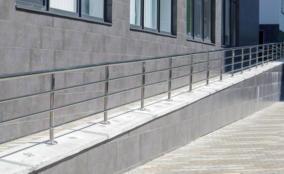 A ramp with stainless steel handrails for wheelchairs, bicycles photo