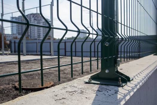 Steel lattice green fence with wire. Fencing. photo