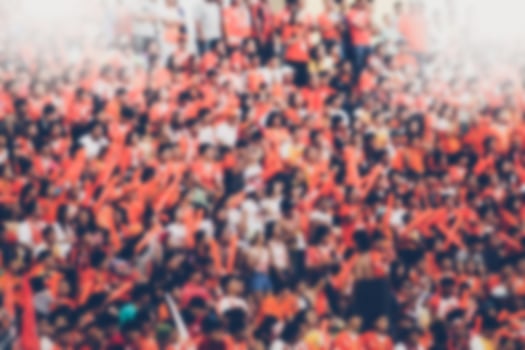 Blurry soccer fan background photo