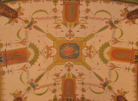 Medieval mural with colour images of coats of arms and feudal emblems photo