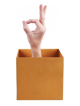 Hand in box shows okay photo
