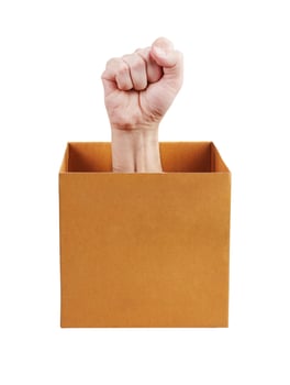 Human fist leaned out of the box photo
