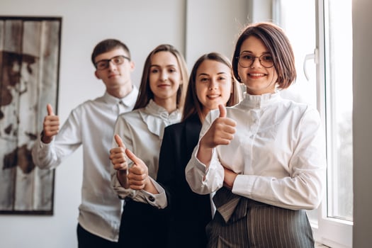 Businesspeople showing thumb up photo