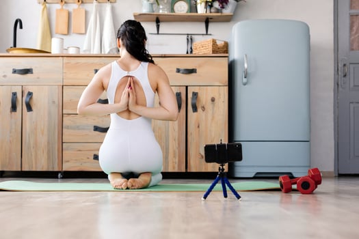 Young girl doing yoga fitness exercise at home photo