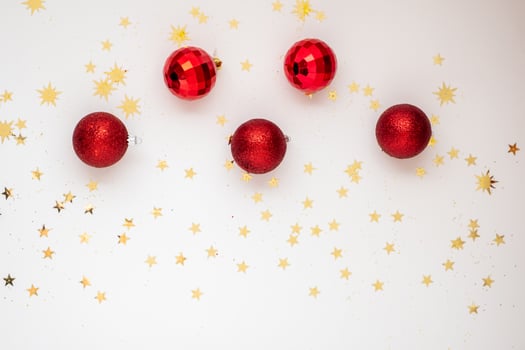 On Light Christmas background are red balls photo