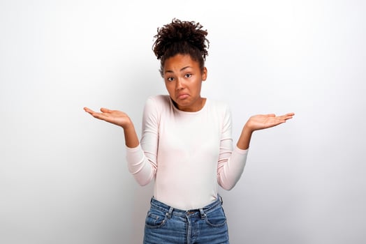 Amazed woman hands apart shrugs shoulders and make displeased face. Concept gesture - Image photo