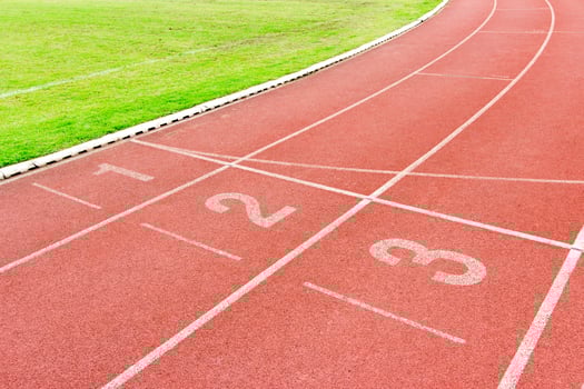 Numbered running track in stadium photo