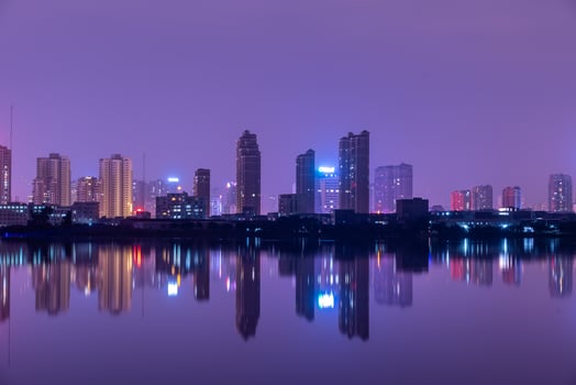 A city reflected by the lake at night photo